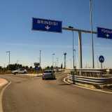 ...superando il cavalcavia che sovrasta la statale 16...